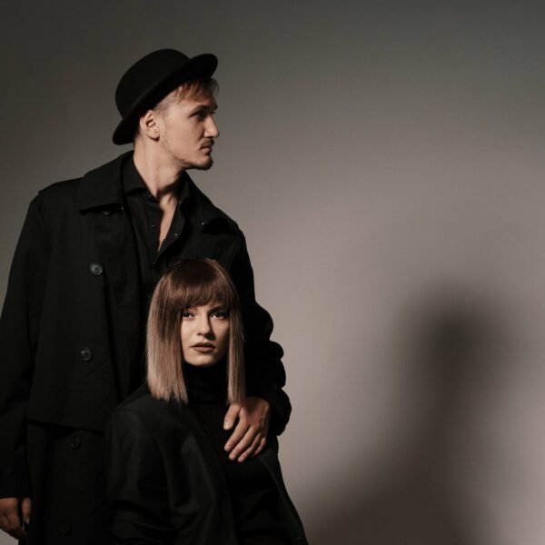 fashionable-woman-sitting-cube-while-man-standing-her (1) (1)